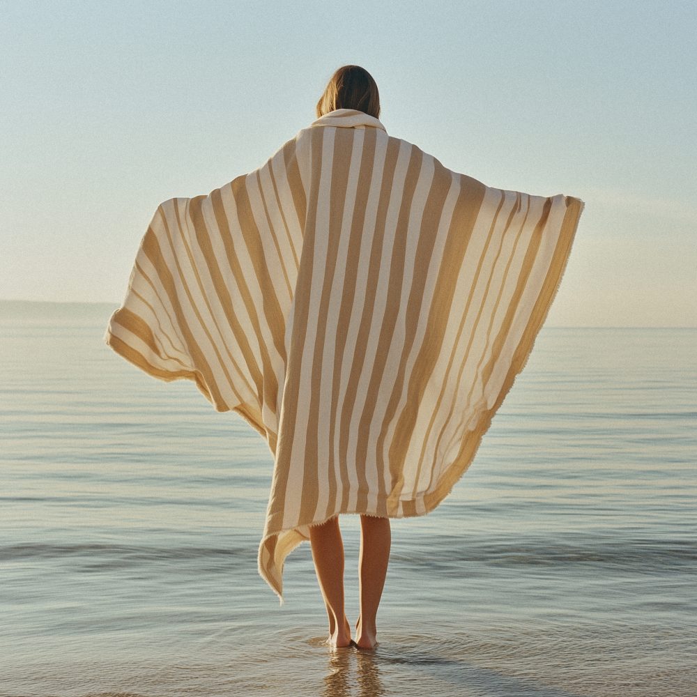 woman_in_striped_blanket_by_sea